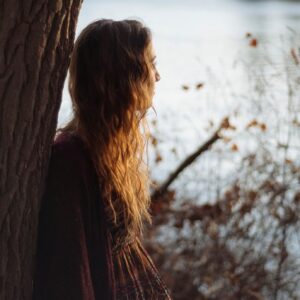 woman and tree listening to body