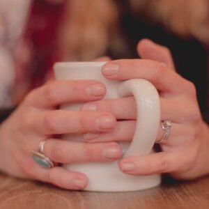 Hands around a mug