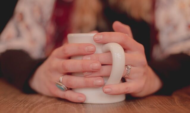 Hands around a mug