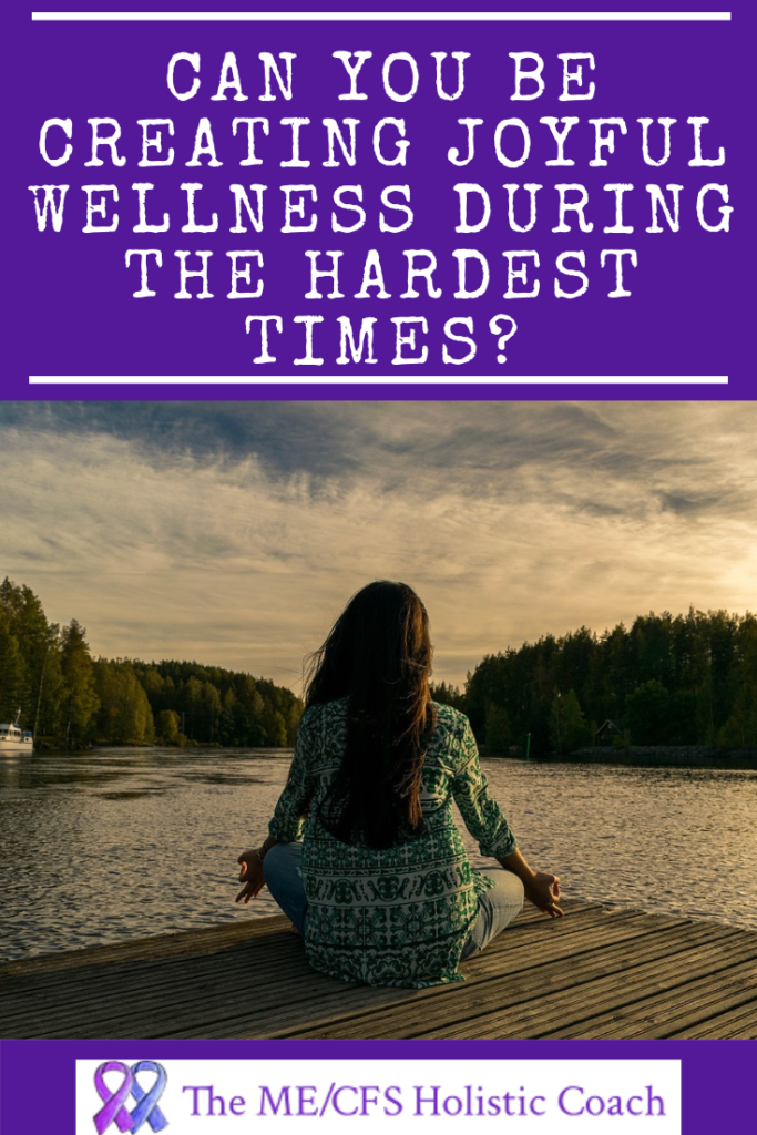 woman meditating in front of a lake